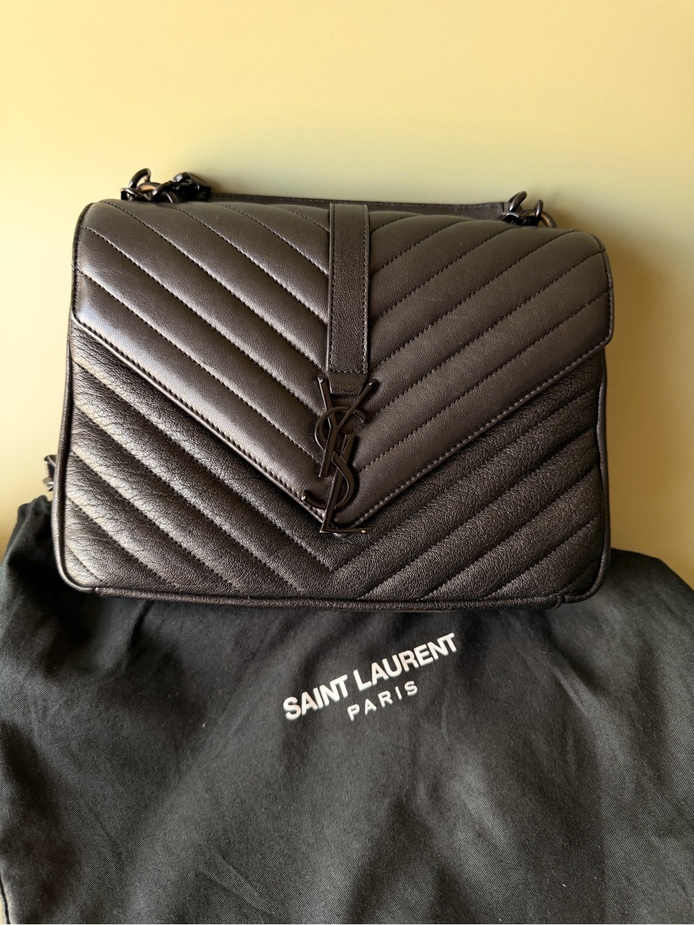 Saint Laurent Black College medium flap top handle bag in quilted leather.
